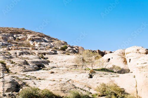 caves on mountain slope in Bab as-Siq