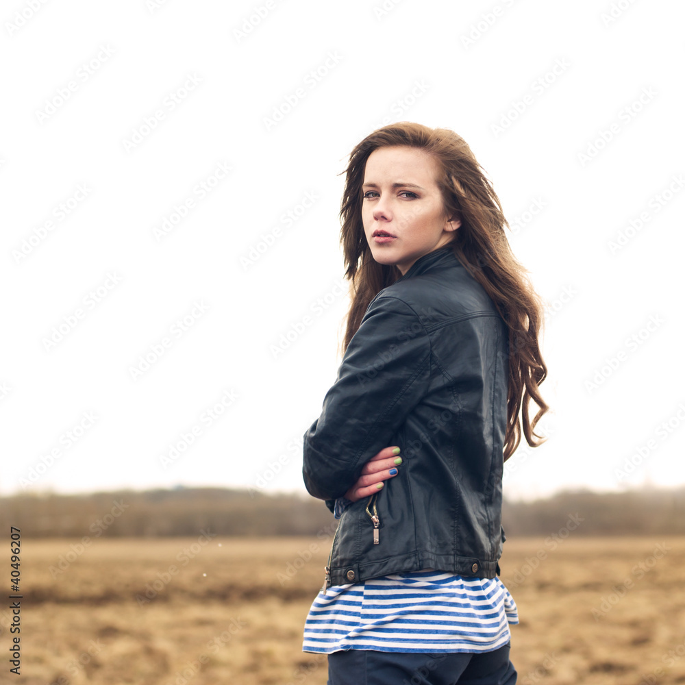Beautiful girl posing in a field Beautiful girl posing in a field