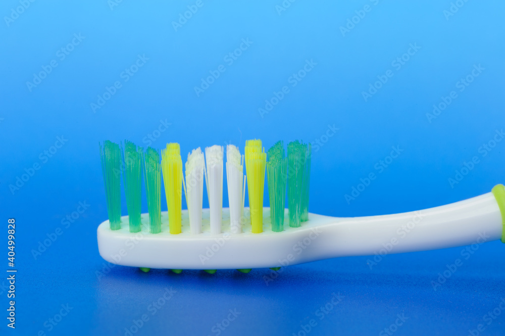 Toothbrush on a blue background Toothbrush on a blue background