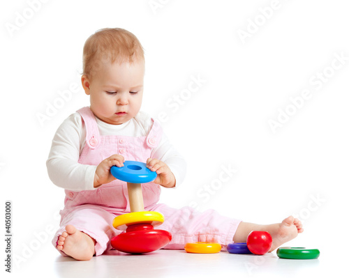 baby playing with color toy