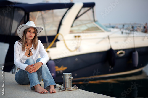 Beautiful woman in front of the yacht © linkova