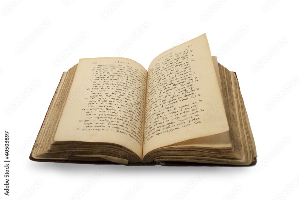 Open old religion book on old slovenic language on isolated whit Open old religion book on old slovenic language on isolated whit