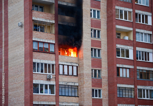 Foto Fire in one of the apartments of a large tenement-house