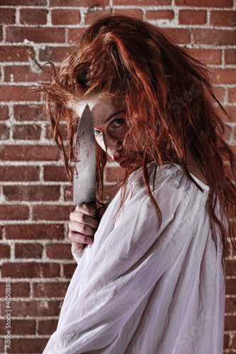 Horror Themed Image With Bleeding Freightened Woman photo