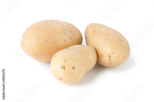 Three potatoes isolated on white