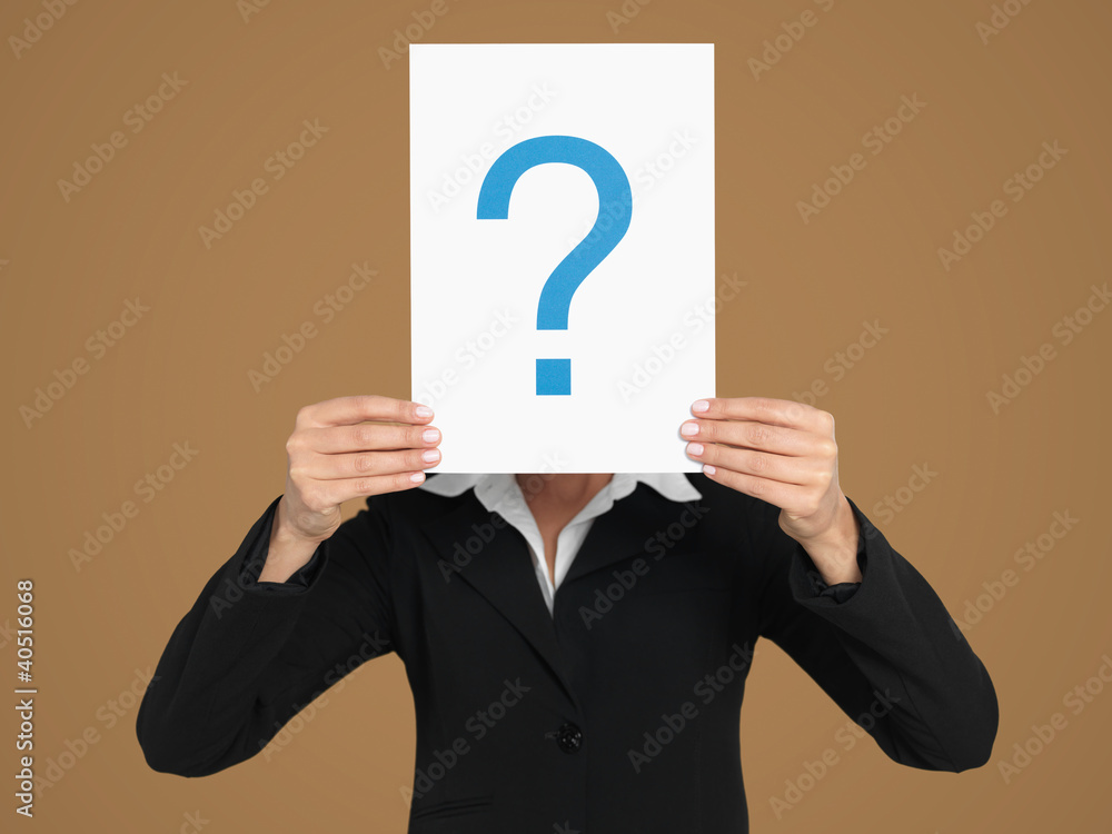 businesswoman holding question mark sign in head businesswoman holding question mark sign in head
