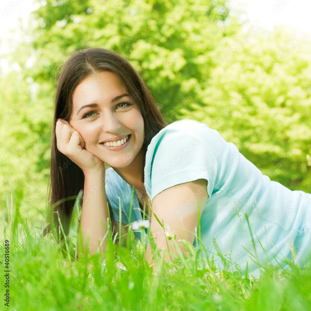 beauty young woman relaxing on grass beauty young woman relaxing on grass