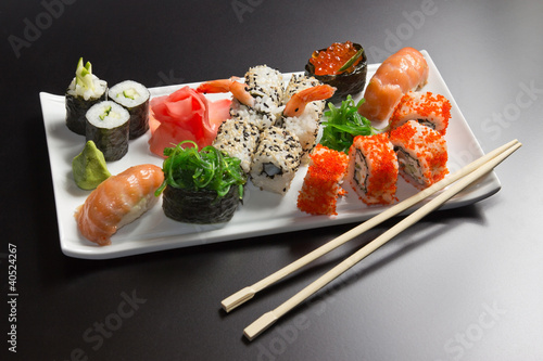 Japanese  seafood  sushi , roll and chopstick on a white plate #40524267