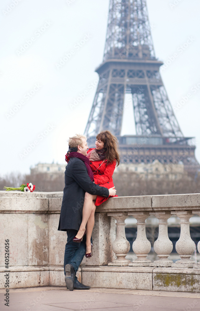 Romantic couple in love dating near the Eiffel Tower