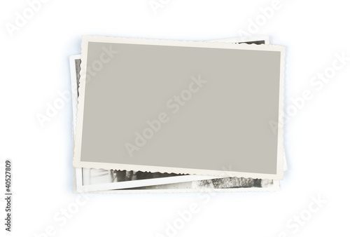Stack of old photos on white background