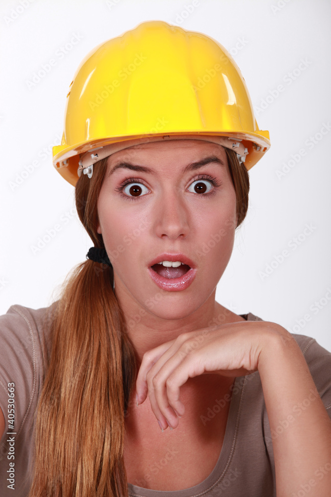 Portrait of an astonished tradeswoman Portrait of an astonished tradeswoman