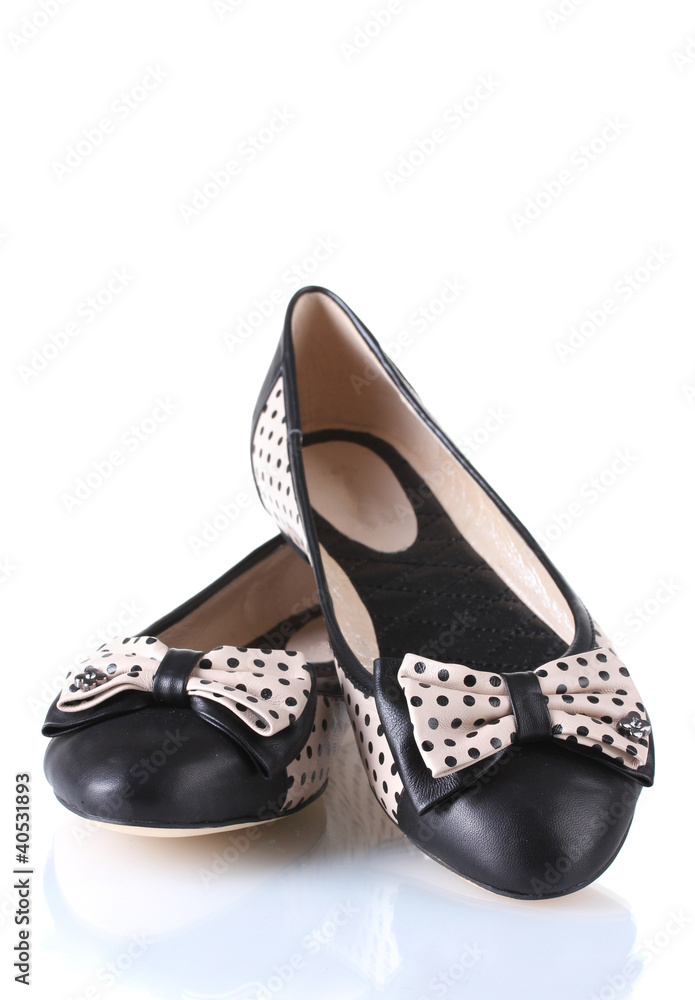 Female flat ballet shoes patterned with black polka dots Female flat ballet shoes patterned with black polka dots