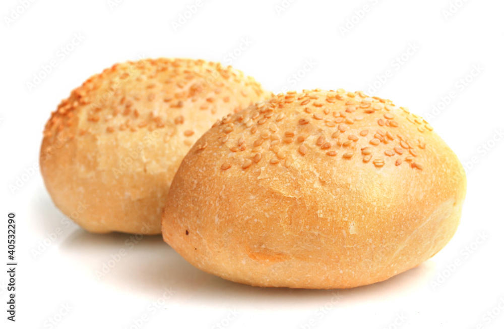 delicious buns with sesame seeds isolated on white