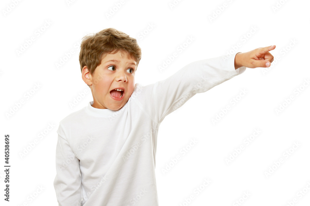 A lttle handsome boy is pointing to the side A lttle handsome boy is pointing to the side