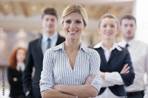 business woman standing with her staff at conference