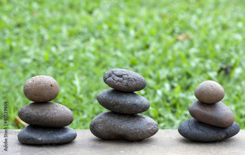 Brown flat stones in blance in the garden on the floor