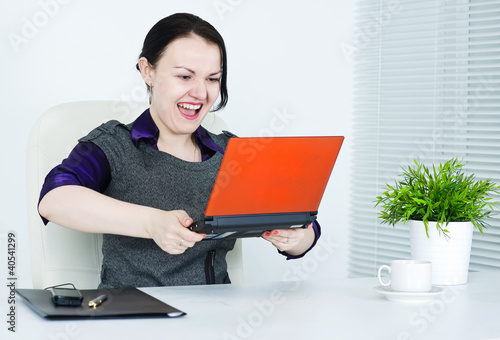 Business woman angry on computer photo