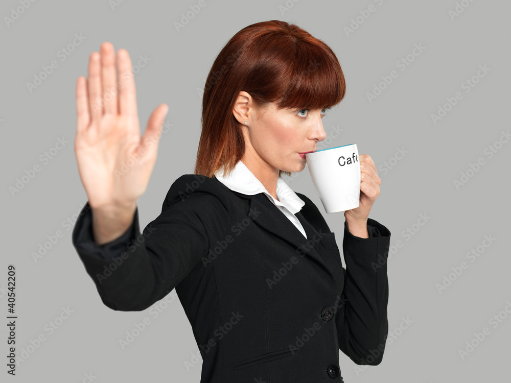 attractive, young businesswoman drinking her morning coffee attractive, young businesswoman drinking her morning coffee