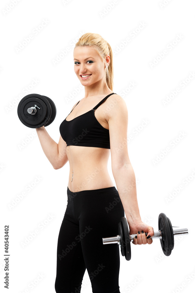 Obraz premium Athletic young lady working out with weights