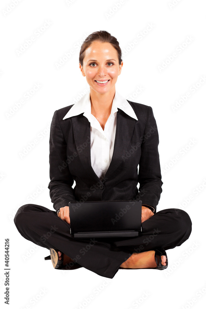 young businesswoman sitting on floor and using laptop young businesswoman sitting on floor and using laptop