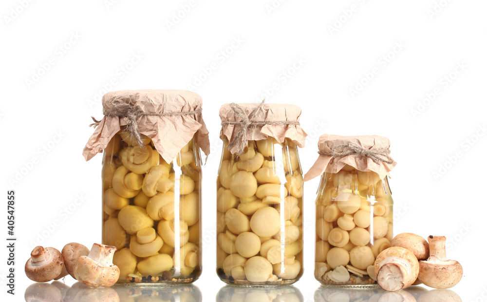 delicious marinated mushrooms in the glass jars and raw delicious marinated mushrooms in the glass jars and raw