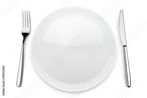 table set with plate, fork and knife on white background