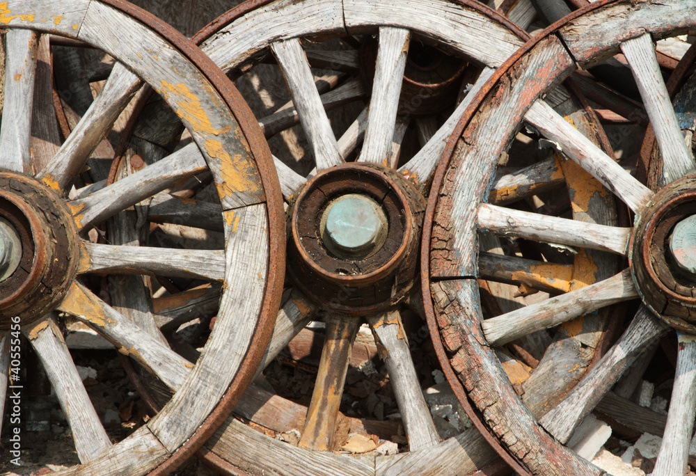 Trio of old wagon cart wheels