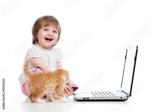 Funny child using a laptop ...