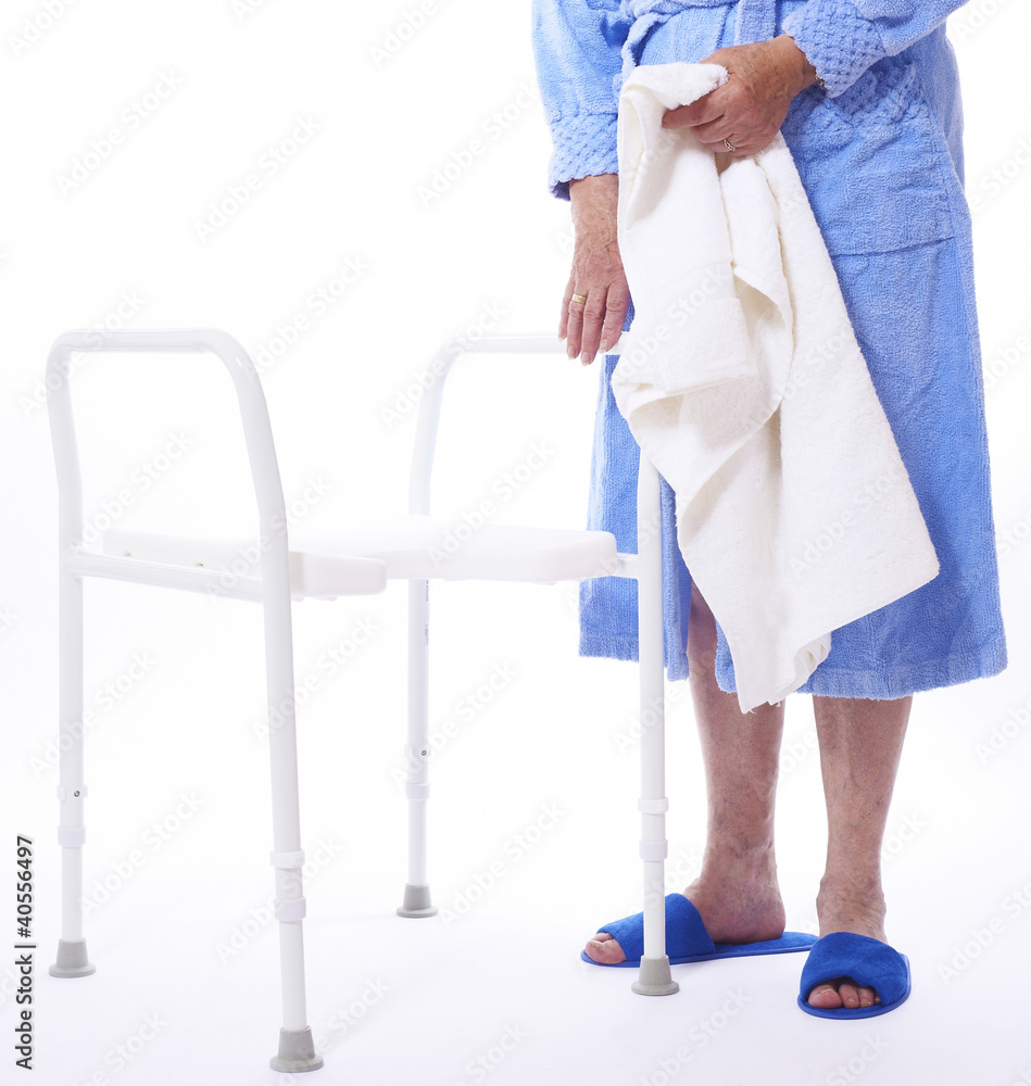 lower bodypart of handicapped old female using a shower seat lower bodypart of handicapped old female using a shower seat