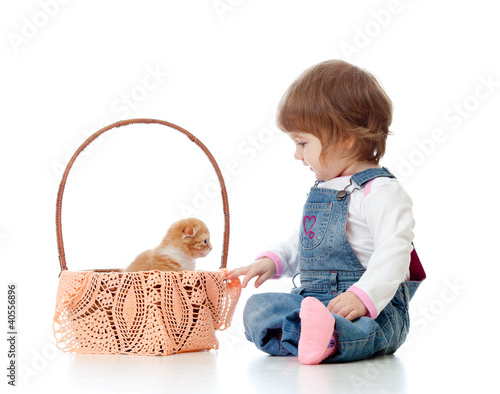 Smiling child sitting down ...