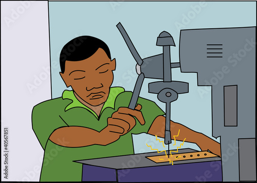 Young black factory worker drilling