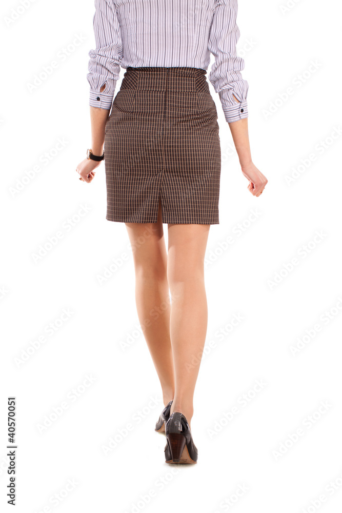 a beautiful young woman wolking away a beautiful young woman wolking away