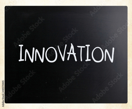 "Innovation" handwritten with white chalk on a blackboard