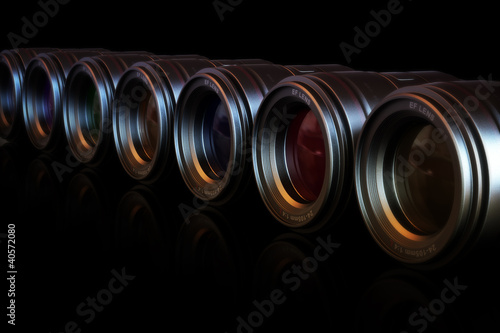 Camera lenses in a row with different color lenses