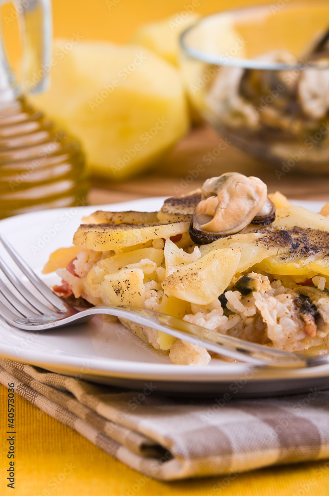 Rice, potatoes and mussels. Tiella di riso, patate e cozze. Rice, potatoes and mussels. Tiella di riso, patate e cozze.