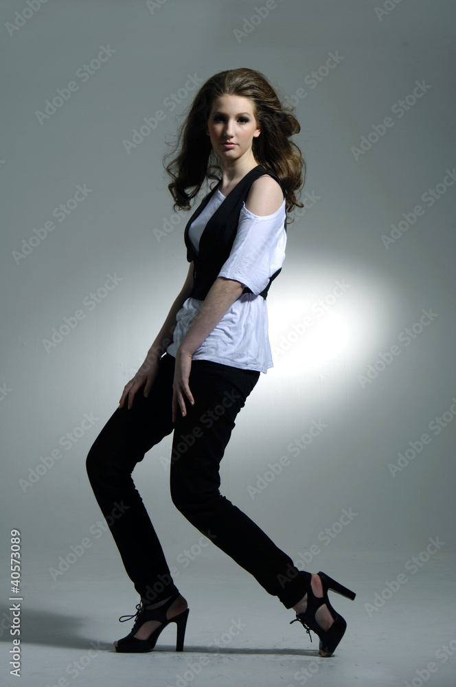 Portrait - model posing at gray background Portrait - model posing at gray background