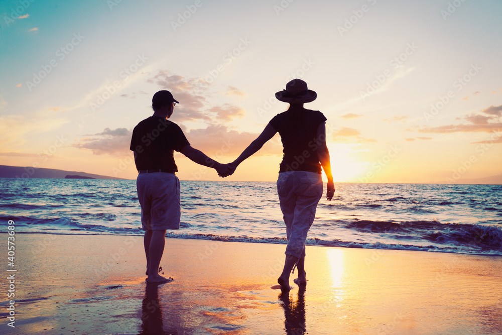 Senior Couple Enjoying Sunset at the Beach - obrazy, fototapety, plakaty 