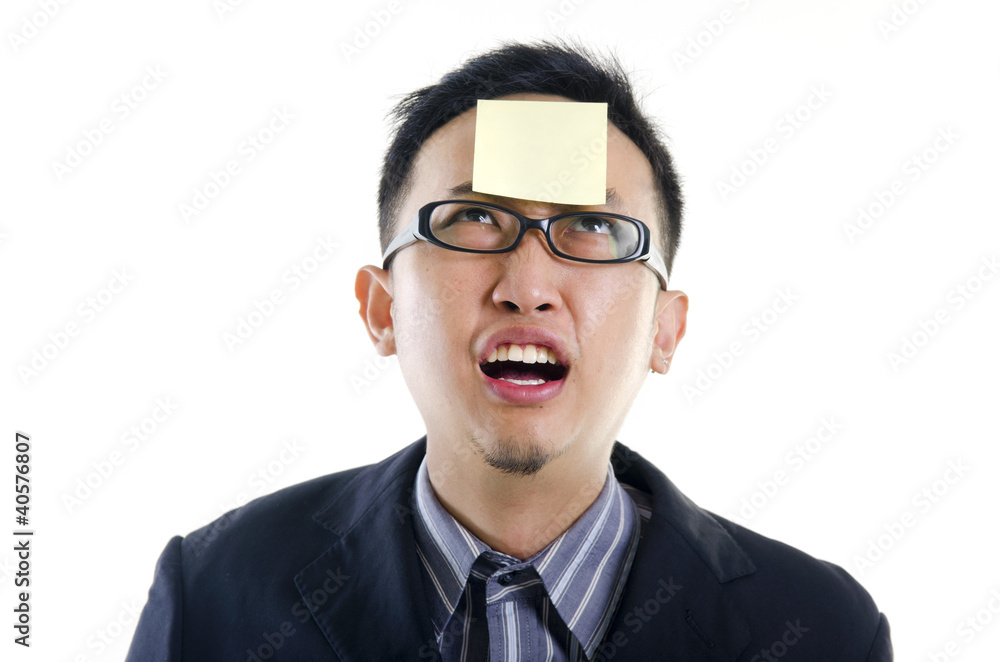 young businessman helpless looking the post it