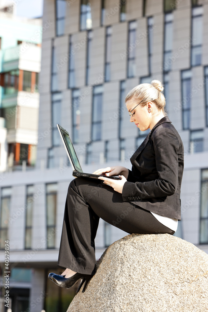 sitting young businesswoman with a notebook sitting young businesswoman with a notebook