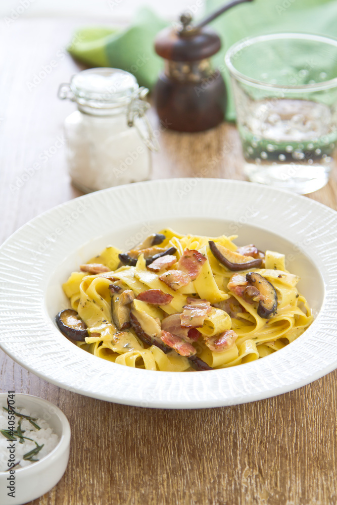Fettuccine Carbonara with bacon and mushroom Fettuccine Carbonara with bacon and mushroom