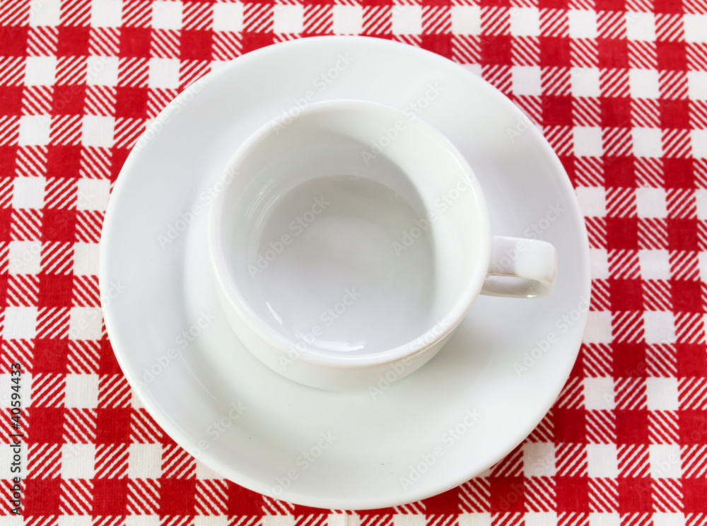 white coffee pair on checkered tablecloth white coffee pair on checkered tablecloth
