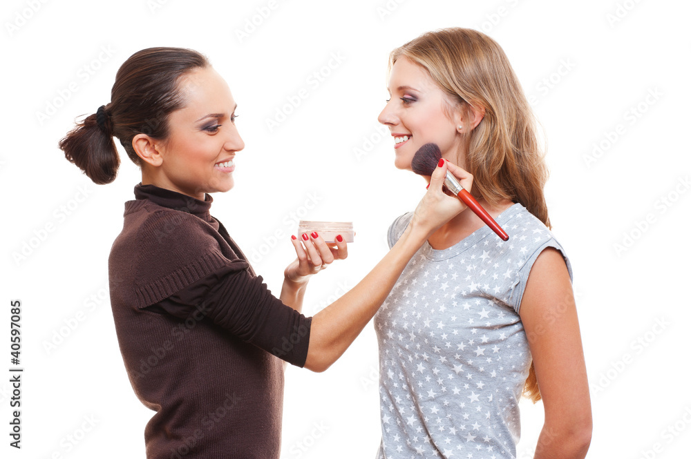 studio picture of make up artist and young woman studio picture of make up artist and young woman