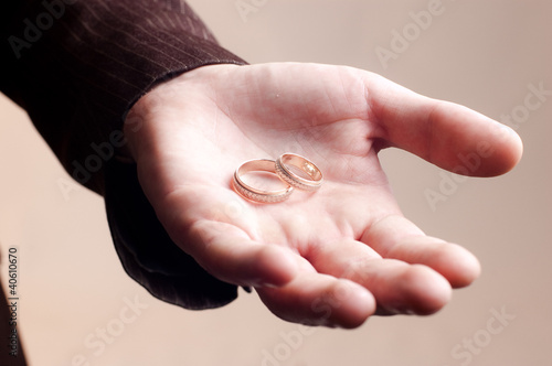 Old golden wedding rings on a man's hand