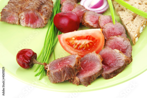 meat food : roast red meat slices served on green plate