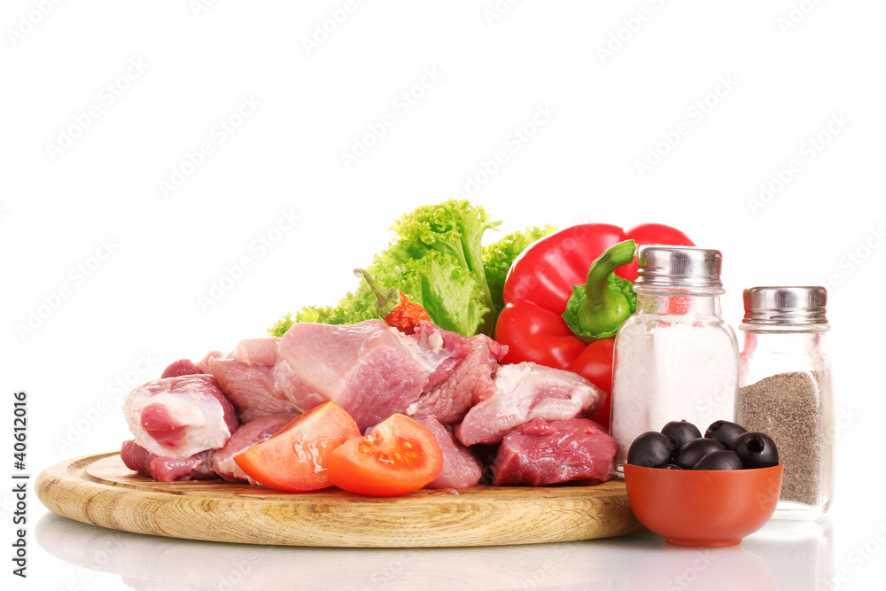 Pieces of raw meat and vegetables
