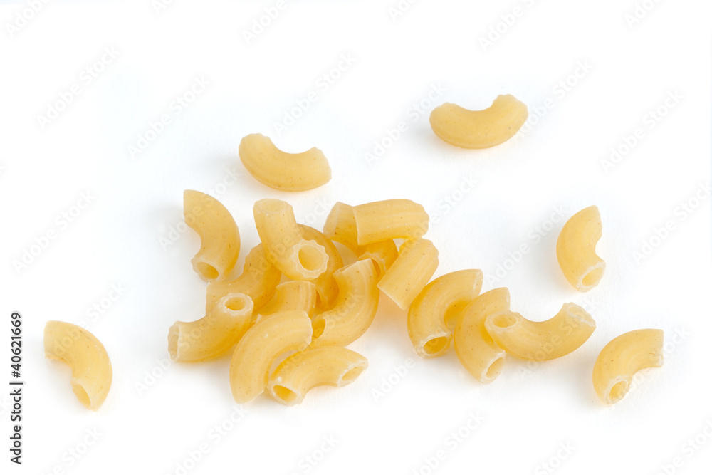 Closeup of a yellow macaroni on a white background Closeup of a yellow macaroni on a white background