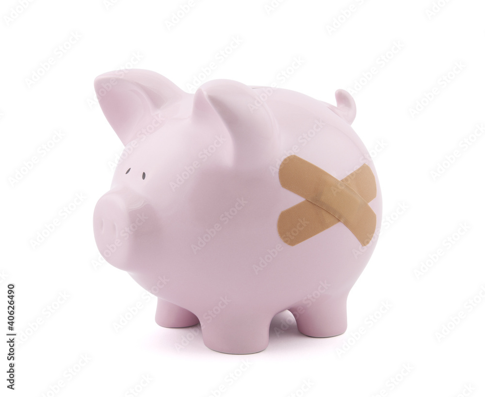 Piggy bank with plaster. Clipping path included. Piggy bank with plaster. Clipping path included.
