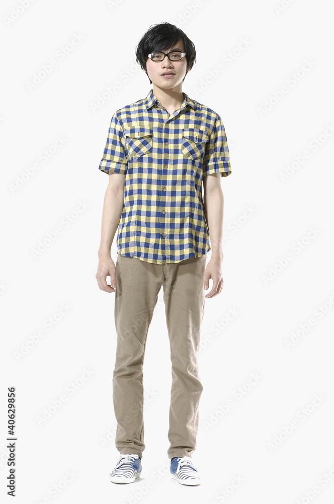 Asian young man standing isolated on white background Asian young man standing isolated on white background