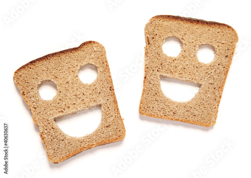 Funny bread slices on white background