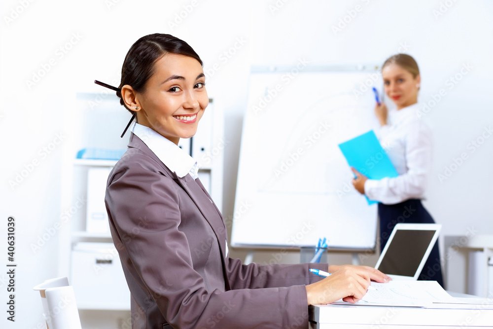 Young woman in business wear working in office Young woman in business wear working in office